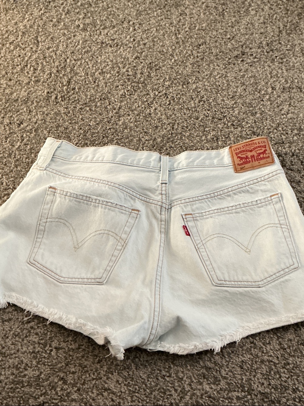 Levi's White Denim Cutoff Shorts with Frayed Hem